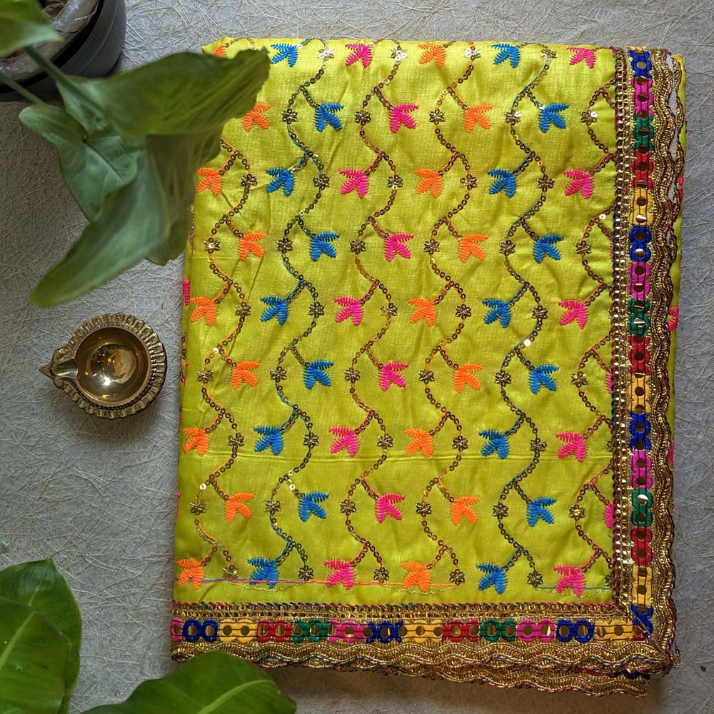 Vibrant Yellow Floral Embroidered Chunari with golden lace border and colorful accents, ideal for pooja rituals and traditional occasions.