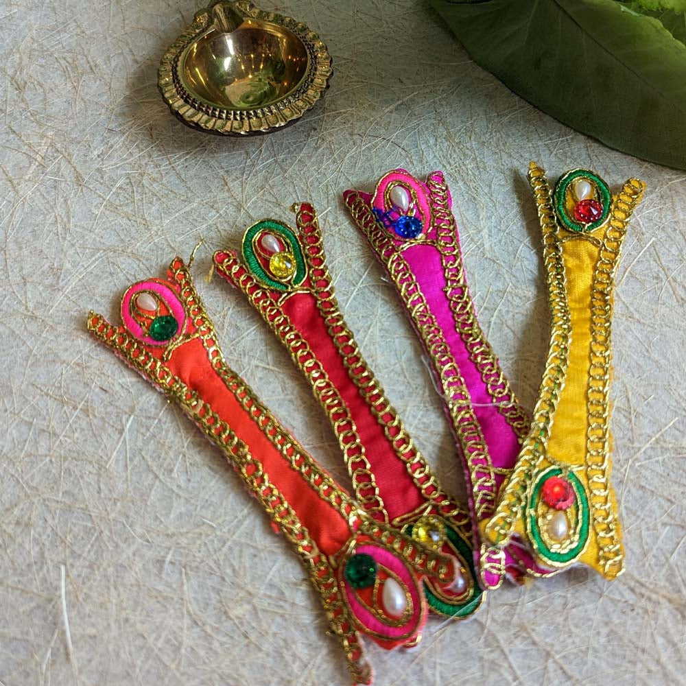 Embroidered 4.5 dupatta set with gold chains and colorful embellishments in yellow, orange, and pink.