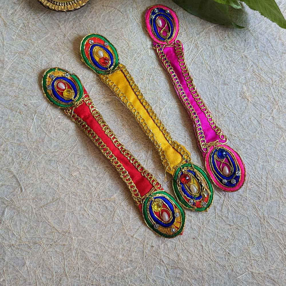 Pink decorative dupatta with peacock feather-inspired design, gold-tone embellishments, and colorful bead accents.