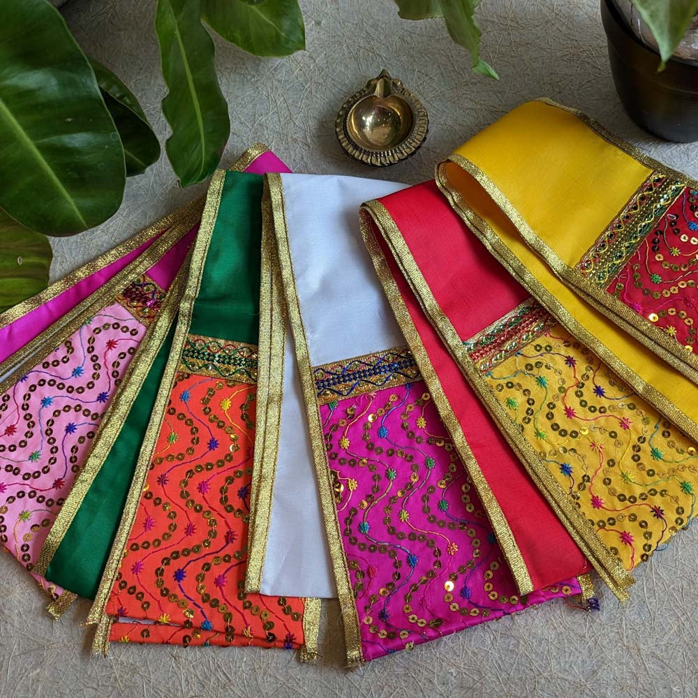 Colorful embroidered traditional dupattas with golden borders, showcasing vibrant patterns and festive charm.