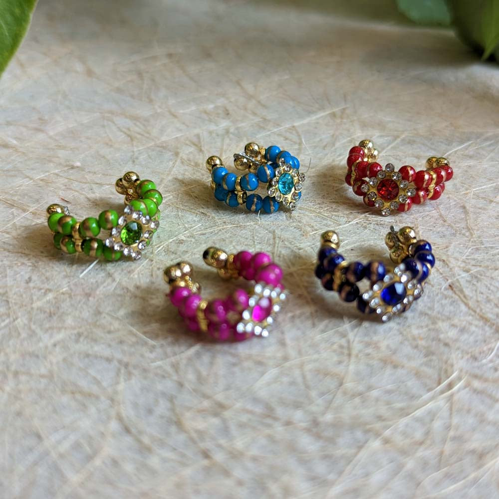 Set of five colorful beaded bracelets with vibrant beads, sparkling embellishments, and gold-tone accents.