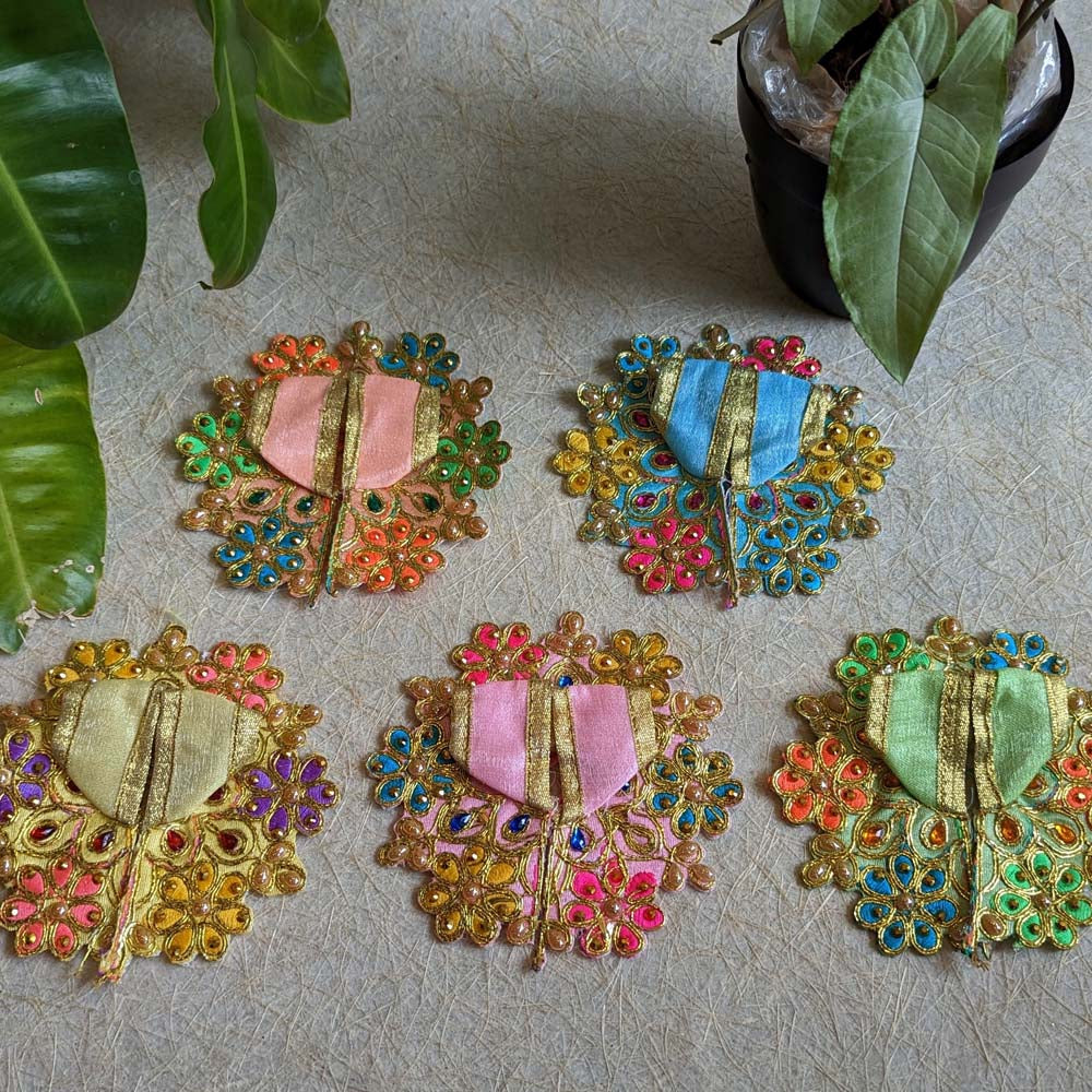 Handcrafted Cream Floral Lalji Vastra with intricate embroidery and embellishments, measuring 4 inches, perfect for temple decor.