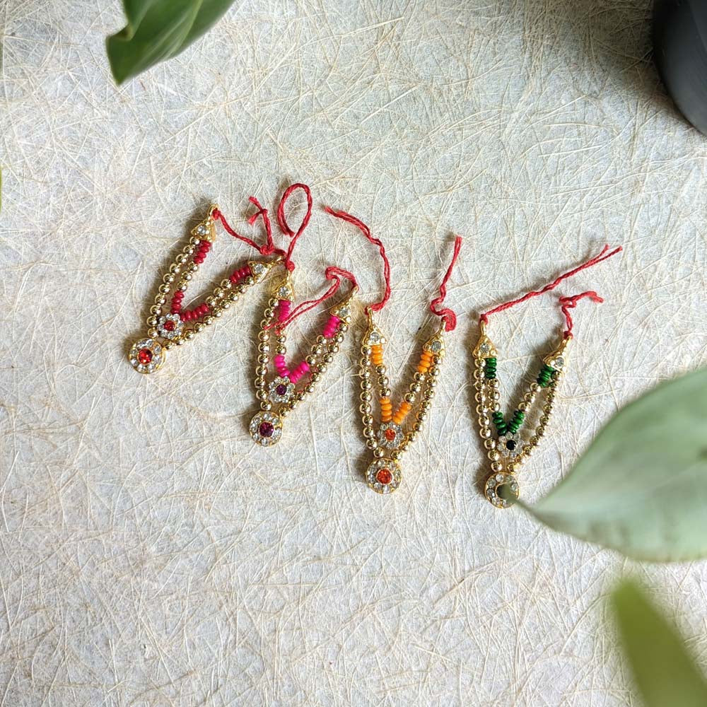 Miniature decorative necklaces with vibrant beads and stone detailing, suitable for idols or figurines.