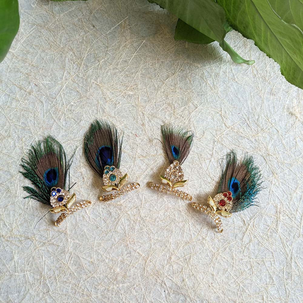 Stone-studded mukut with peacock feather, measuring 3 inches, perfect for adorning deity idols and festive decor.