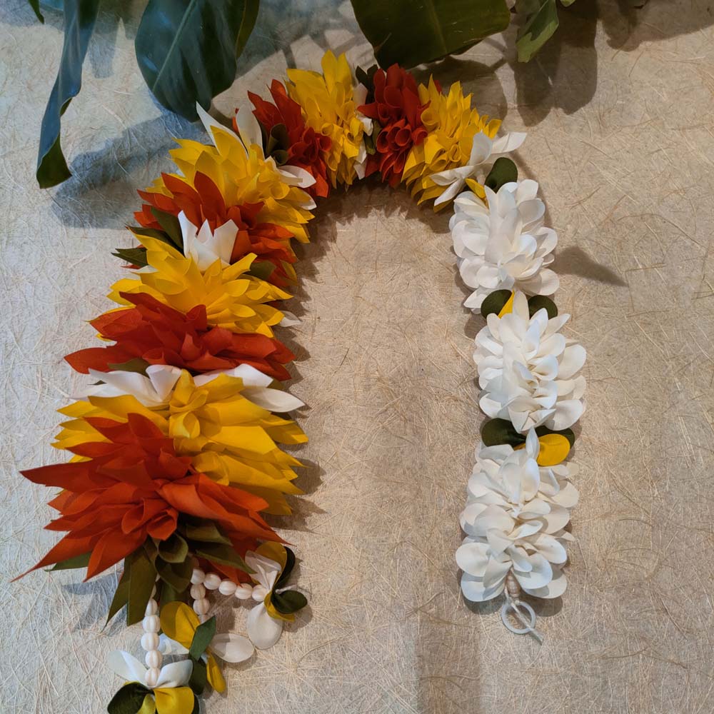 A set of two artificial floral garlands featuring yellow and red flowers with green accents, ideal for festive and wedding decor.