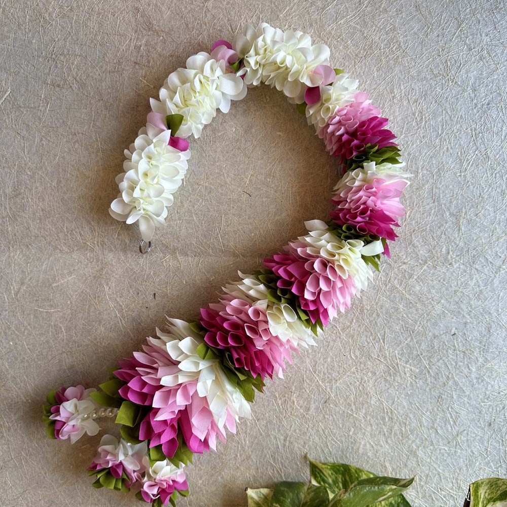 A set of two artificial floral garlands featuring white and pink flowers with green accents, ideal for festive and wedding decor.