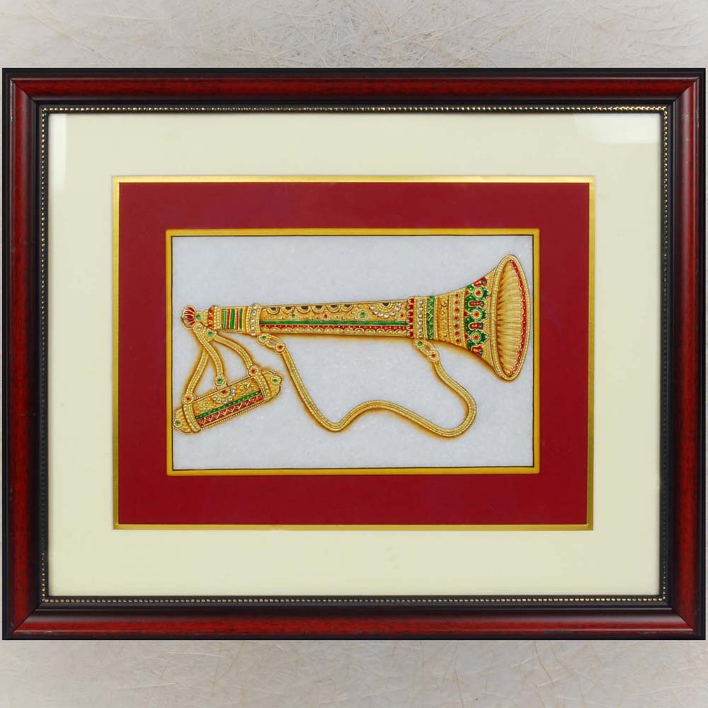 Gemstone painting of Shehnai on a marble base with intricate detailing and vibrant embellishments, framed elegantly with red and ivory mat borders.