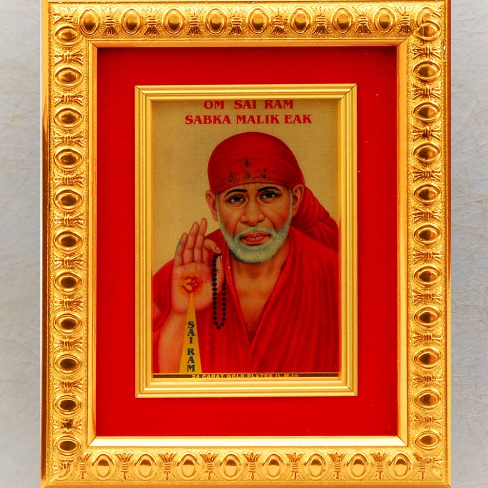 Divinity Golden Sai Baba photo frame with vibrant red backdrop and intricate golden border.