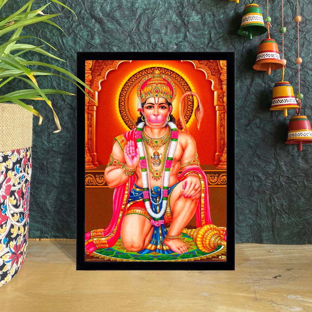 Lord Hanuman kneeling in a blessing pose with vibrant orange background and intricate detailing.