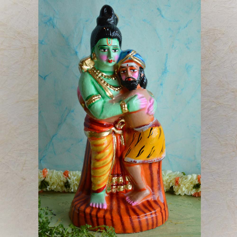 Handcrafted Ramayana Golu Doll depicting Lord Rama embracing Guha, showcasing their friendship and devotion, in vibrant colors.