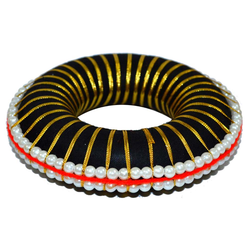 Traditional Bharatanatyam hair ring with black base, gold ribbon, and pearl embellishments