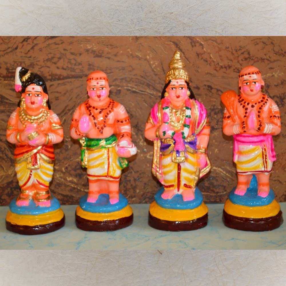 Handcrafted Saints Nalvar Figurine Set with vibrant traditional attire and detailed hand-painted features.
