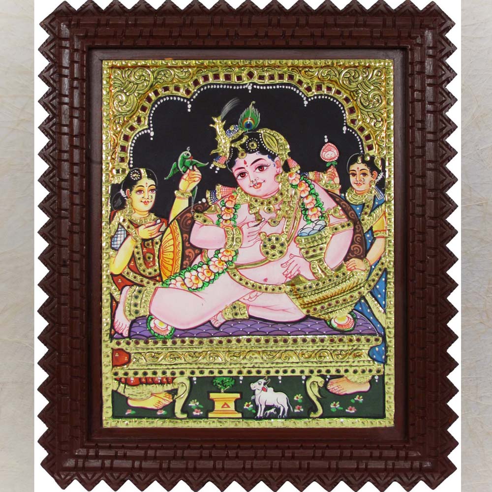Tanjore painting of Butter Krishna with intricate gold foil work, depicting baby Krishna relishing butter and surrounded by playmates.