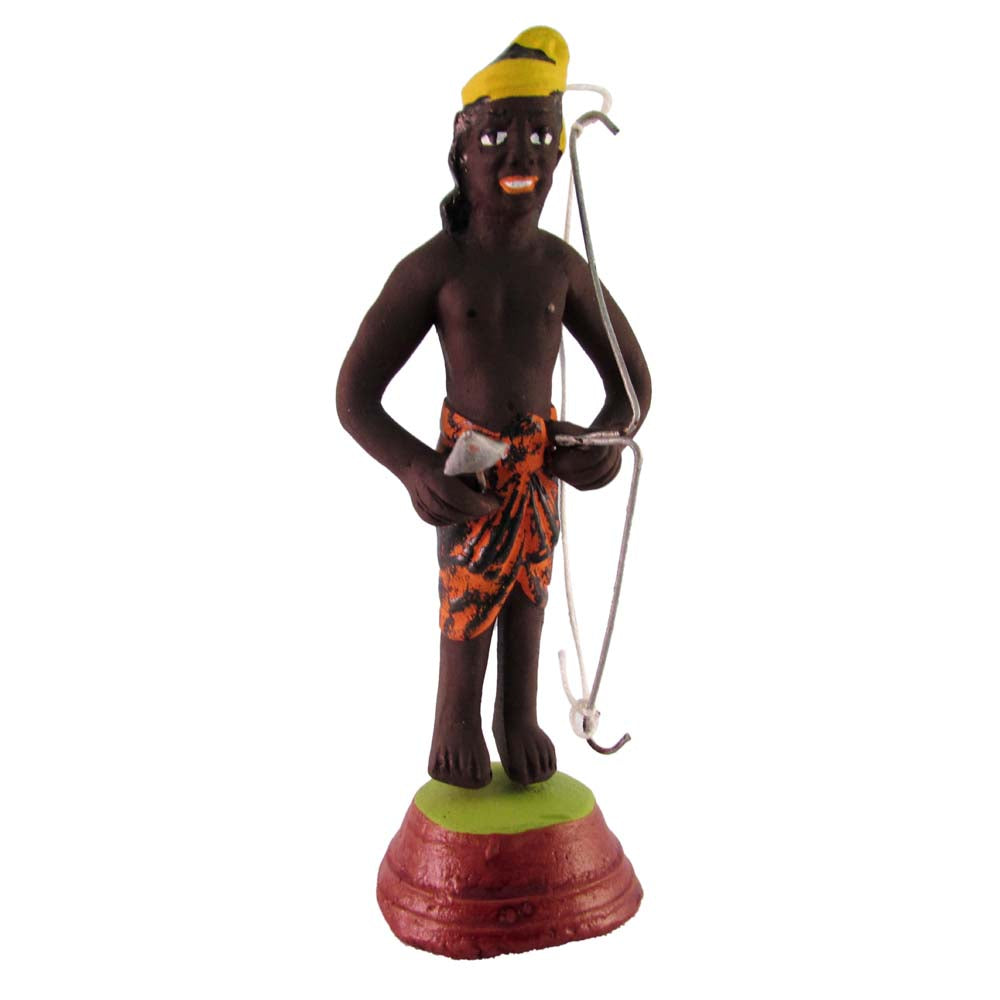 Miniature Golu doll of a traditional village hunter holding a bow, wearing a yellow headpiece and colorful attire