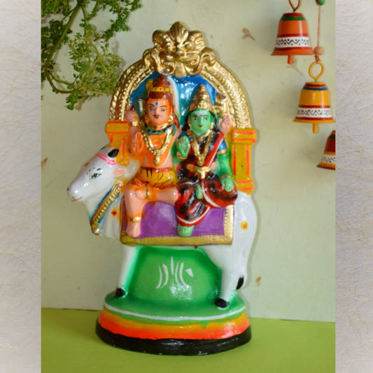 Handcrafted Rishaba Vahanam figurine featuring Lord Shiva and Goddess Parvati seated on Nandi, with vibrant detailing for Navaratri Golu.