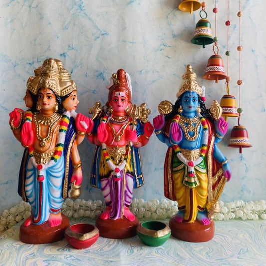 Navarathri Golu Trimurti 3-piece set featuring Brahma, Vishnu, and Shiva figurines with vibrant colors and golden accents.