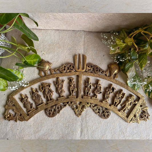 Dasavatharam Brass Wall Hanging featuring Lord Vishnu's ten avatars, with intricate carvings, a Trishul, conch, and discus design.