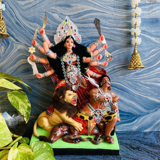 Large handcrafted Durga Golu doll with vibrant colors, jewel embellishments, and intricate details, featuring Durga slaying Mahishasura on a lion mount.