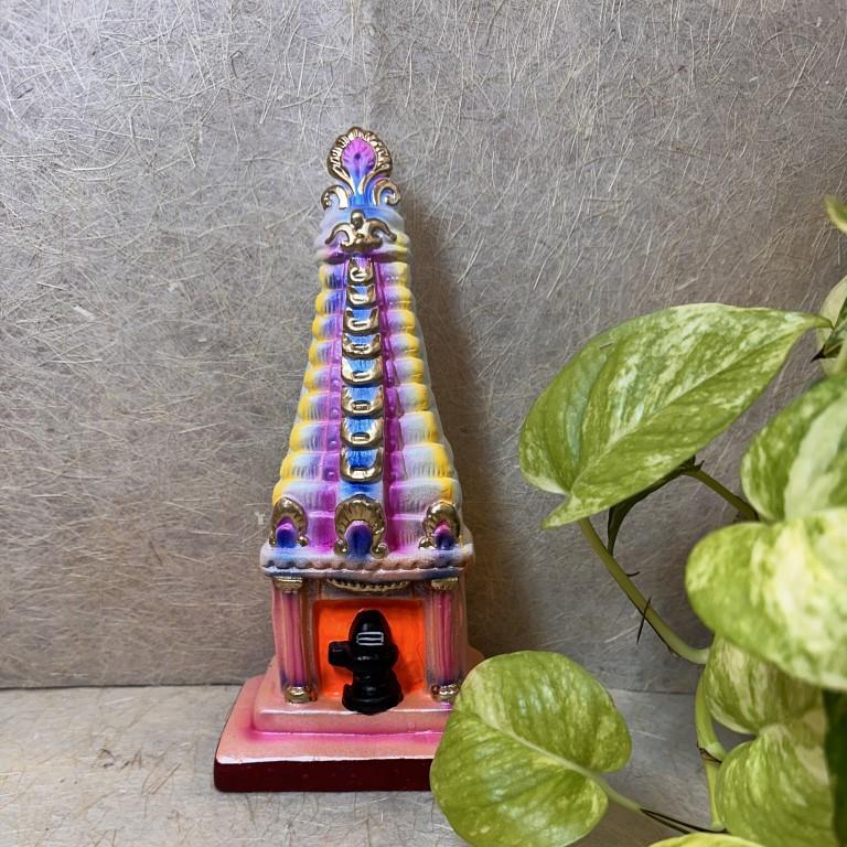 Handcrafted Navarathri Golu doll of a vibrant Gopuram with a Shiva Lingam at its base.
