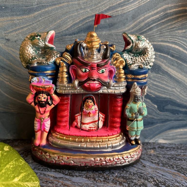 Handcrafted Navarathri Golu doll set depicting Krishna's birth in prison, with Vasudeva carrying Krishna and Devaki inside the prison cell.