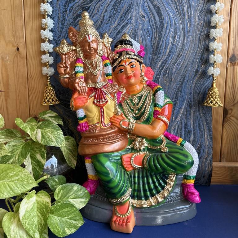 Handcrafted Andal Kodhai Golu doll with vibrant colors and intricate details, displayed with traditional decor and greenery.