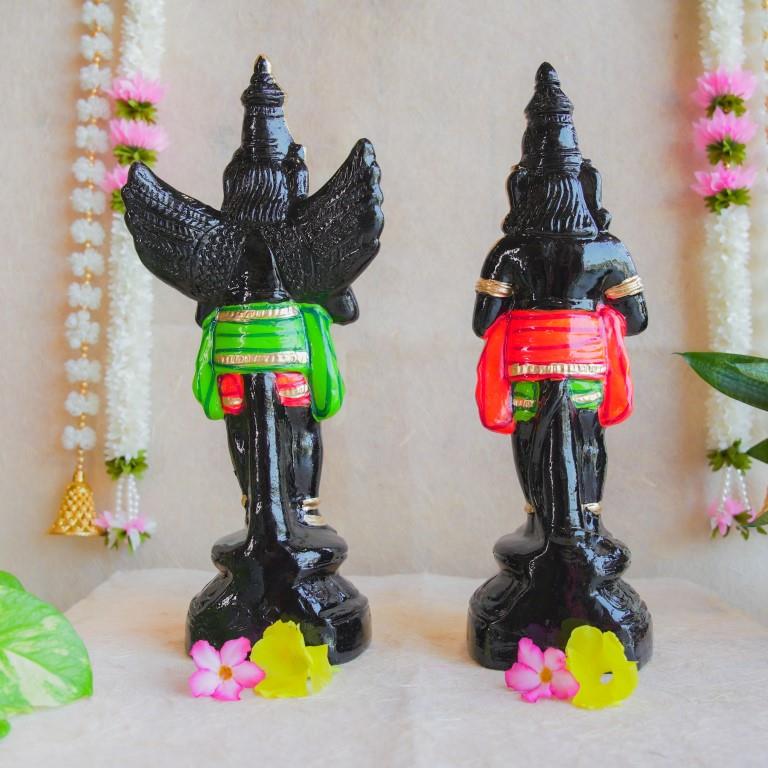 Handcrafted Navarathri Golu dolls depicting Black Hanuman and Garuda in vibrant traditional attire with gold embellishments.