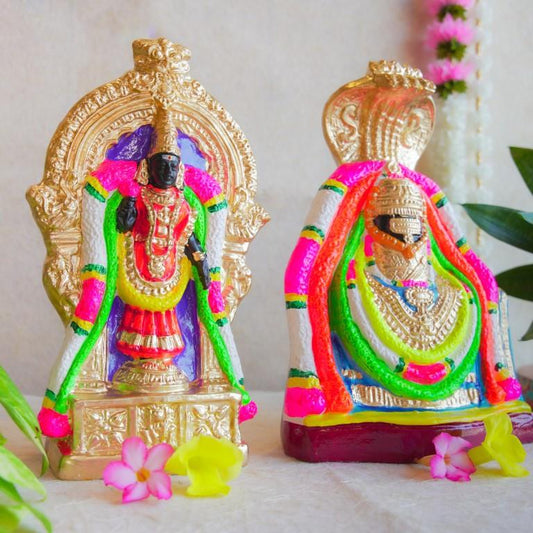 Handcrafted Navarathri Golu dolls of Lord Annamalaiyar and Goddess Unnamalaiyar adorned with vibrant colors and intricate ornaments.