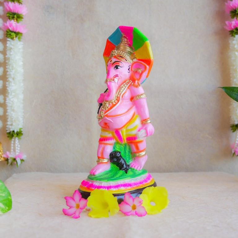Handcrafted Navarathri Golu doll of Lord Ganesh with a vibrant multicolored umbrella, ideal for festive decorations.