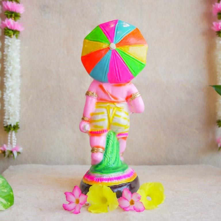 Handcrafted Navarathri Golu doll of Lord Ganesh with a vibrant multicolored umbrella, ideal for festive decorations.