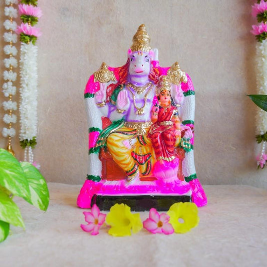 Handcrafted Navarathri Golu doll depicting Lord Hayagriva seated with Goddess Lakshmi, painted in vibrant colors with intricate details.