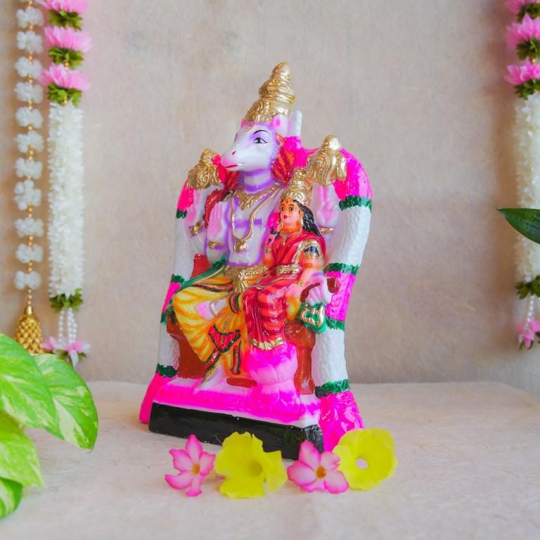 Handcrafted Navarathri Golu doll depicting Lord Hayagriva seated with Goddess Lakshmi, painted in vibrant colors with intricate details.