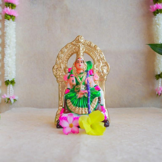 Handcrafted Navarathri Golu Doll of Goddess Kamakshi seated on a golden throne, adorned in vibrant green and gold.