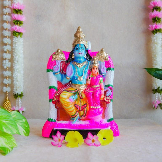 Handcrafted Navarathri Golu Dolls featuring Lord Vishnu and Goddess Lakshmi seated on a decorated throne.