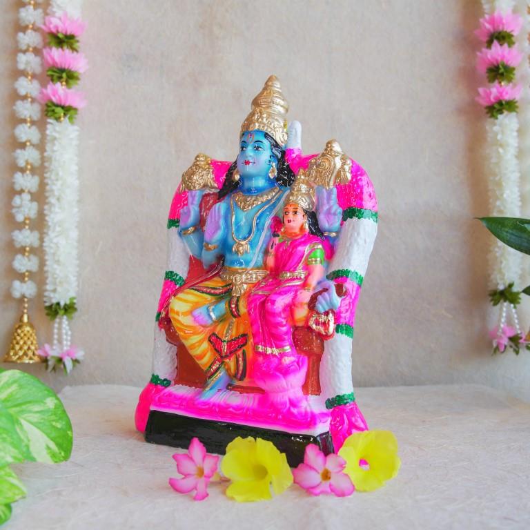 Handcrafted Navarathri Golu Dolls featuring Lord Vishnu and Goddess Lakshmi seated on a decorated throne.