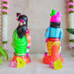 Handcrafted Navarathri Golu Dolls featuring Lord Krishna with a flute and Andal in traditional attire with vibrant colors.