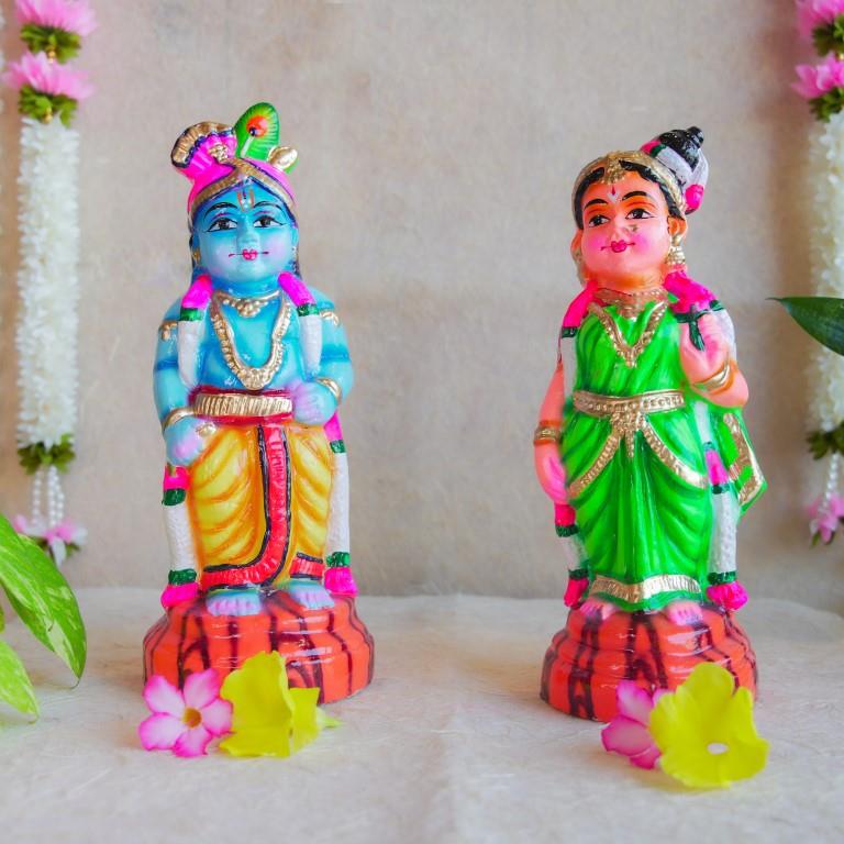 Handcrafted Navarathri Golu Dolls featuring Lord Krishna with a flute and Andal in traditional attire with vibrant colors.