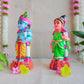 Handcrafted Navarathri Golu Dolls featuring Lord Krishna with a flute and Andal in traditional attire with vibrant colors.
