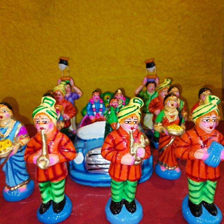 Handcrafted Navarathri Golu Marriage Car Procession Set featuring a peacock-adorned car, musicians, bridesmaids, and relatives in vibrant colors.