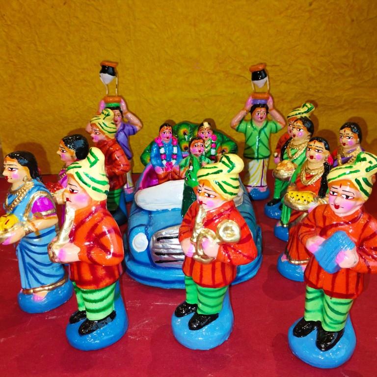 Handcrafted Navarathri Golu Marriage Car Procession Set featuring a peacock-adorned car, musicians, bridesmaids, and relatives in vibrant colors.