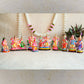 Handcrafted Arupadai Veedu Navaratri Golu Doll Set showcasing Lord Murugan in his six abodes with Valli and Deivayanai, vibrantly colored and intricately detailed.