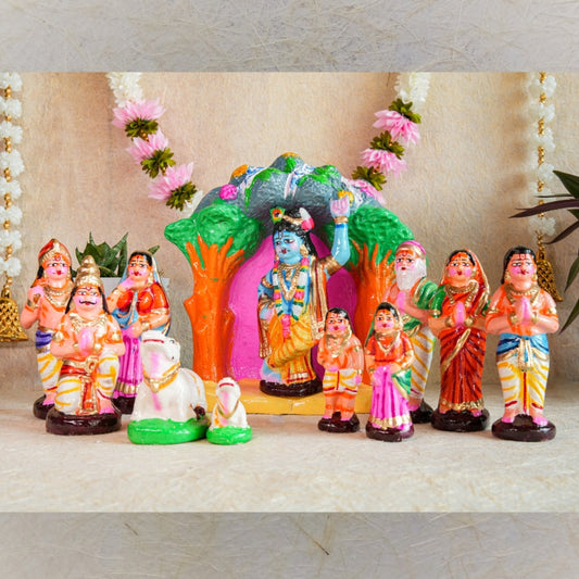 Handcrafted Krishna Govardhana Giri Navaratri Golu Doll Set featuring Lord Krishna lifting the Govardhana Giri, surrounded by devotees and cows in vibrant colors.