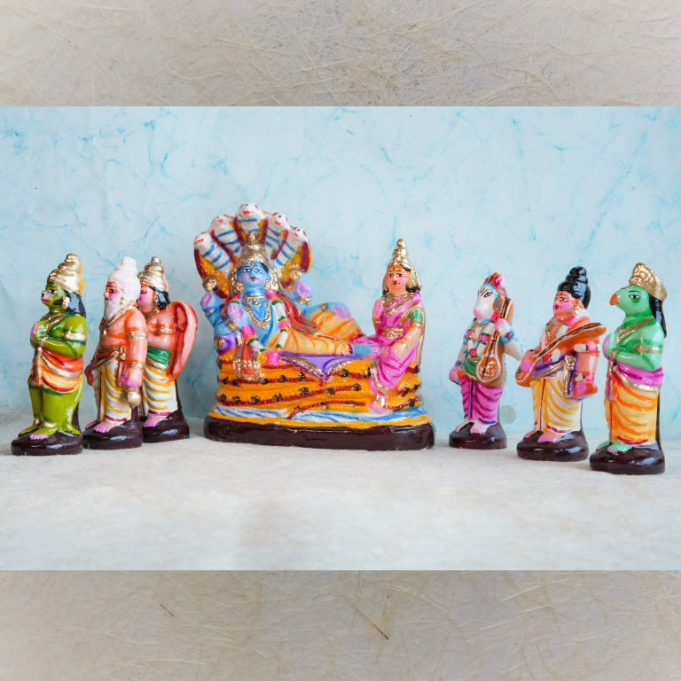 Handcrafted Vaikuntam Navaratri Golu Doll Set featuring Lord Vishnu reclining on Adisesha with Goddess Lakshmi and celestial devotees, vibrantly painted and detailed.