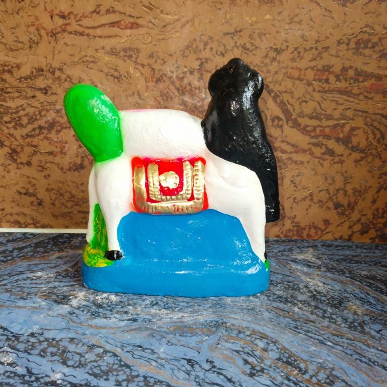 Handcrafted Kamadhenu Navaratri Golu Doll with vibrant colors and intricate details, symbolizing abundance and prosperity.