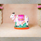 Handcrafted Navarathri Golu Kamadhenu figurine with vibrant detailing, featuring a sacred cow and calf, symbolizing abundance and prosperity.