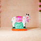Handcrafted Navarathri Golu Kamadhenu figurine with vibrant detailing, featuring a sacred cow and calf, symbolizing abundance and prosperity.
