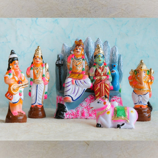 Handcrafted Navarathri Golu Thiruvilayadal doll set featuring Lord Shiva, Goddess Parvati, Lord Ganesha, Lord Murugan, Nandi, and divine companions in vibrant colors.