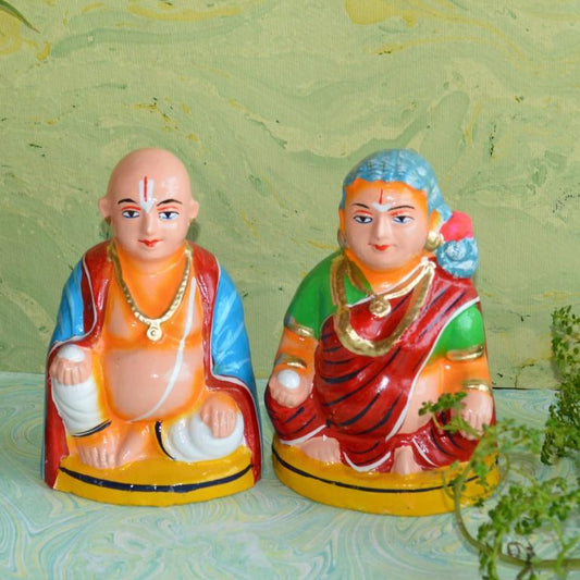 Handcrafted Navaratri Golu Chettiyar and Chettiachi doll set with Naamam, symbolizing South Indian merchant culture, in vibrant colors and detailed designs.