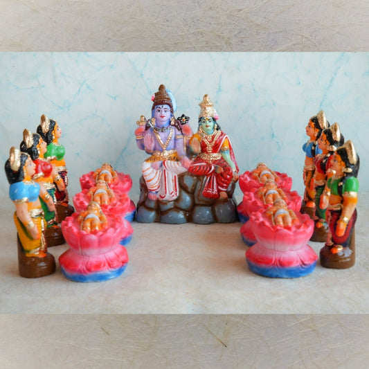 Handcrafted Karthigai Pengal set featuring celestial caretakers with Lord Shiva, Goddess Parvati, and infant Muruga, ideal for Navaratri Golu displays.