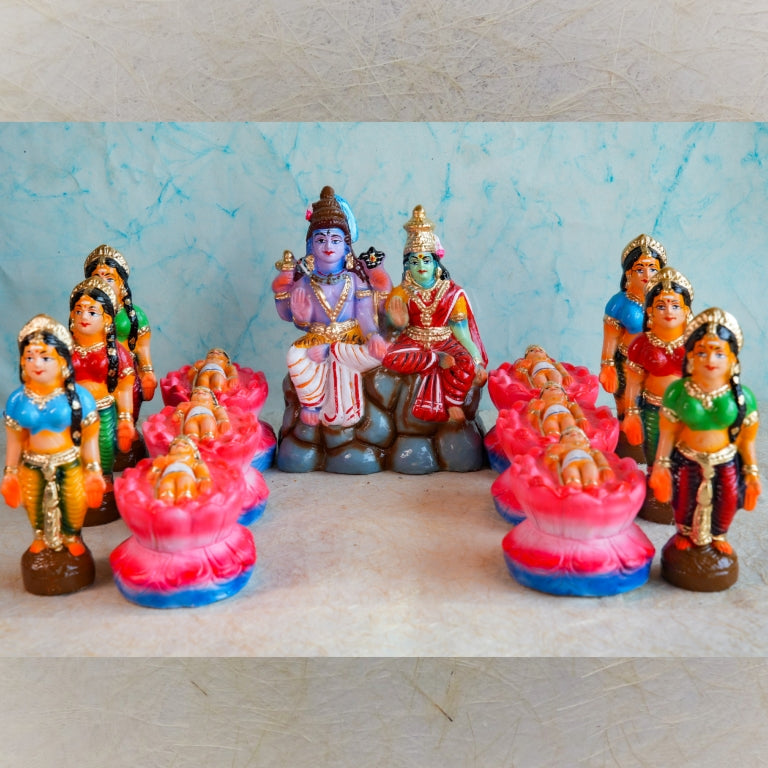 Handcrafted Karthigai Pengal set featuring celestial caretakers with Lord Shiva, Goddess Parvati, and infant Muruga, ideal for Navaratri Golu displays.