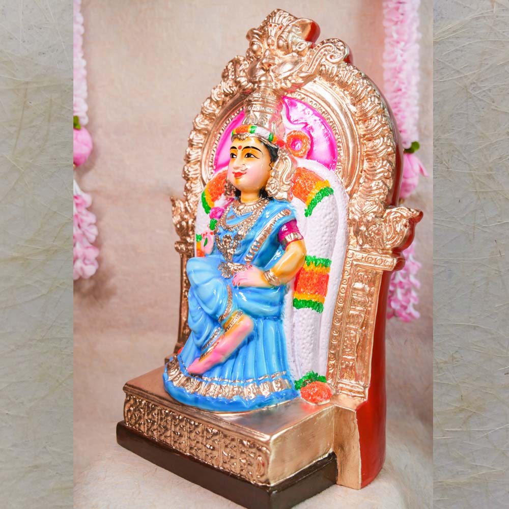 Kamalambigai Amman idol seated on a golden ornate throne, dressed in a blue saree with vibrant detailing, perfect for Indian festivals and home decor.
